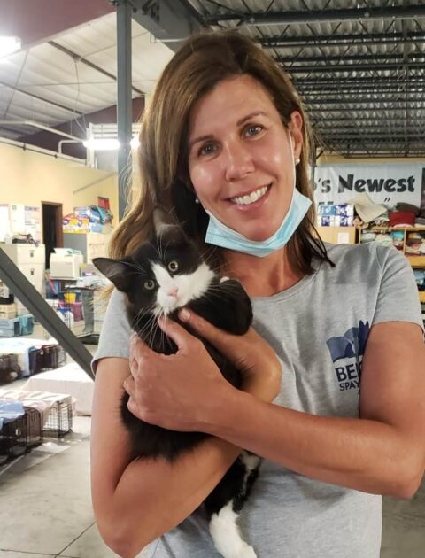 Kristin Des Marais holding cat at clinic